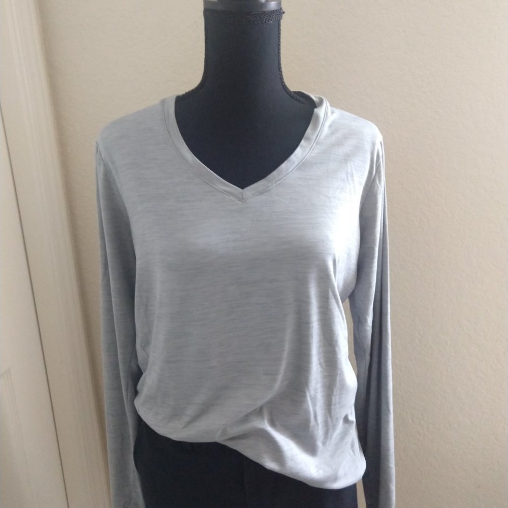 Heather gray, RBX women's long sleeve pullover V-neck shirt with thumb holes